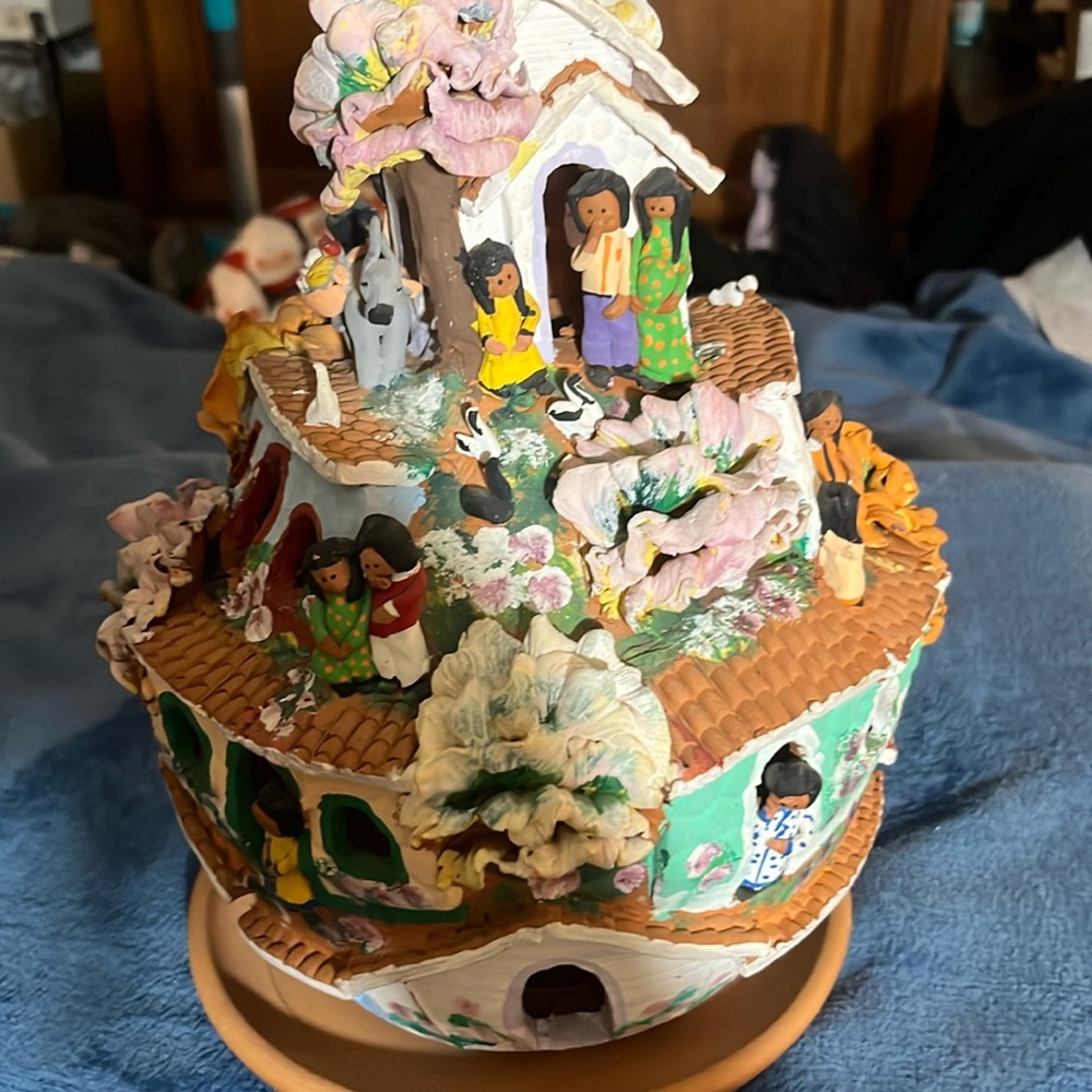 Peruvian red clay art